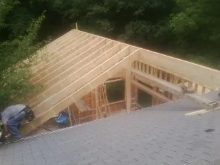 Framing a new roof addition that ties into an existing shingle roof in Ashland